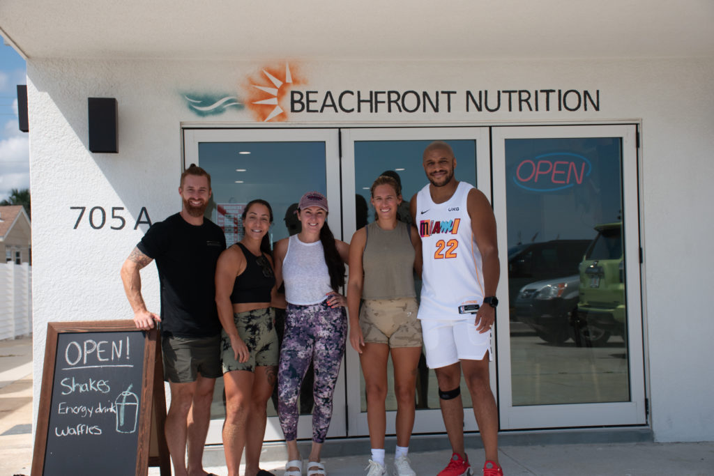 Founders of Flagler Outdoor Fitness in front of Beachfront Nutrition