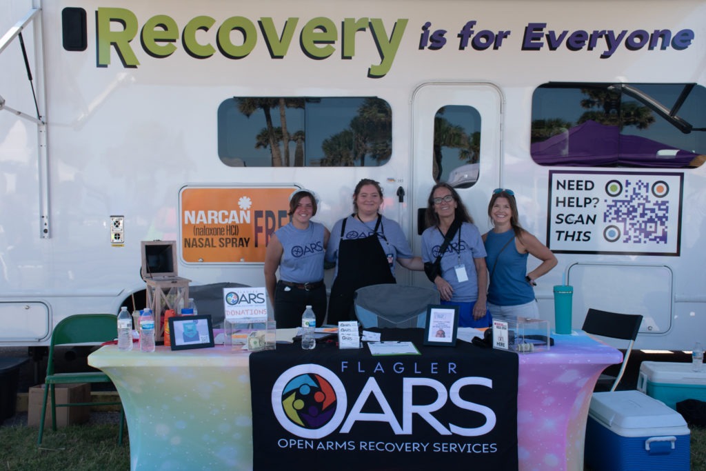 Staff and Volunteers of Flagler OARS in front of their bus