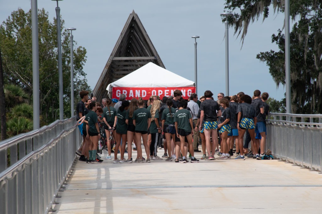 crowd gathered a top of the new pedestrian bridge for the ribbon cutting