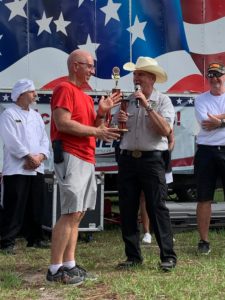 Flagler county fire chief and flagler county sheriff during official award ceremony over chili cook off