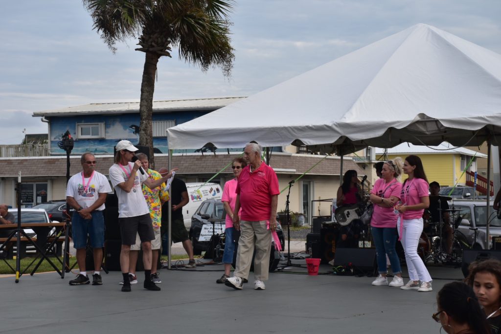 First friday stage as radio annoucers introduce the band and vendors 