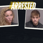 Two mugshots are displayed side by side on a dark background A woman with curly blonde hair and a man with short brown hair, both wearing dark colored clothing, are shown The word "ARRESTED" is prominently overlaid at the top of the image