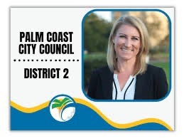 Portrait of a smiling person with shoulder length blonde hair, wearing a black blazer and white shirt The text reads "Palm Coast City Council, District " with a city logo featuring a palm tree