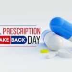 Illustration for National Prescription Drug Take Back Day features blue and white capsules, white tablets, and a yellow pill The event title is prominently displayed in bold letters next to the pills