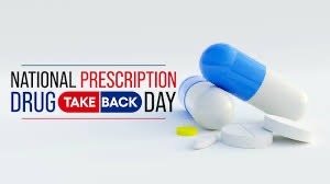 Illustration for National Prescription Drug Take Back Day features blue and white capsules, white tablets, and a yellow pill The event title is prominently displayed in bold letters next to the pills