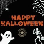 Halloween themed image with "Happy Halloween" in orange, surrounded by a spider web, bats, a ghost, and a skeleton The Flagler County Sheriff’s Office badge is in the center The background is black