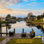 A scenic view of a calm canal surrounded by houses, palm trees, and docks at sunset A yellow banner reads, "Take the Saltwater Canal Dredging Survey, Open Nov , ," with a QR code and logo in the corner