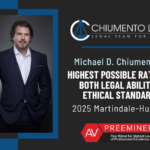 Lawyer standing confidently with arms crossed, wearing a suit Text reads: "CHIUMENTO LAW Michael D Chiumento III Highest possible rating in both legal ability & ethical standards Martindale Hubbell AV Preeminent