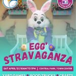 Poster featuring an event called "Egg'Stravaganza" with a costumed Easter Bunny sitting on a bench It’s scheduled for Sat, April , AM PM at Central Park, Town Center Activities include yard games, food trucks, and crafts